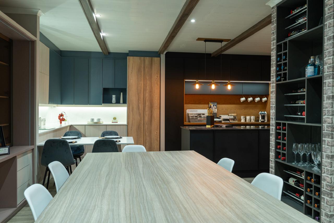 Lé Grandt showroom with bespoke cabinetry, display storage and a central meeting table