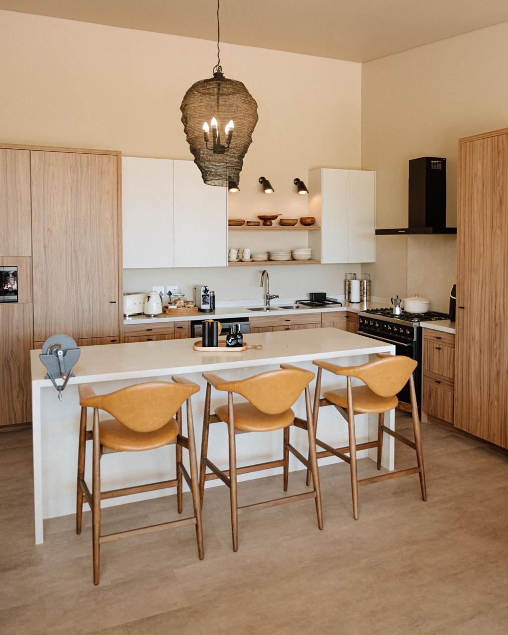 Warm timber and white kitchen with central island and bar seating