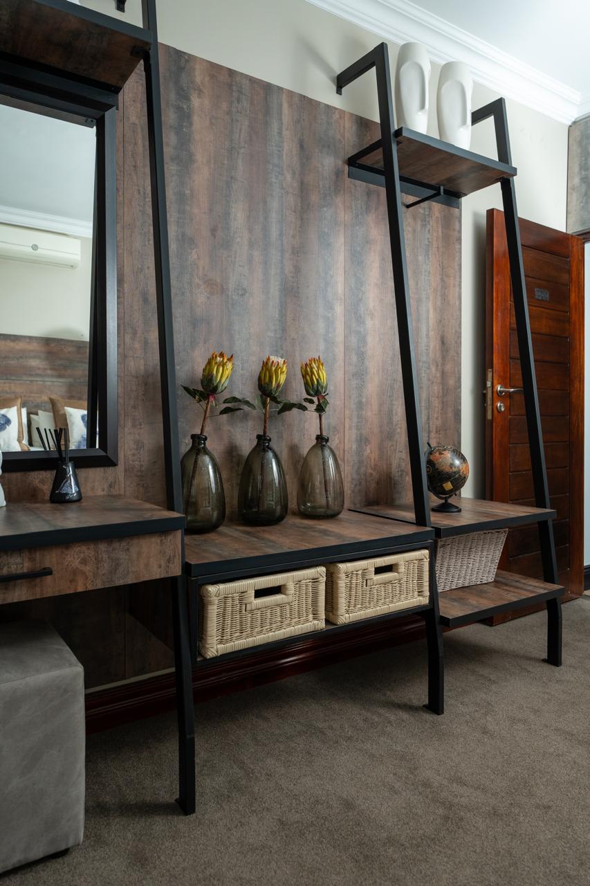Timber bedroom dressing unit with black metal shelving