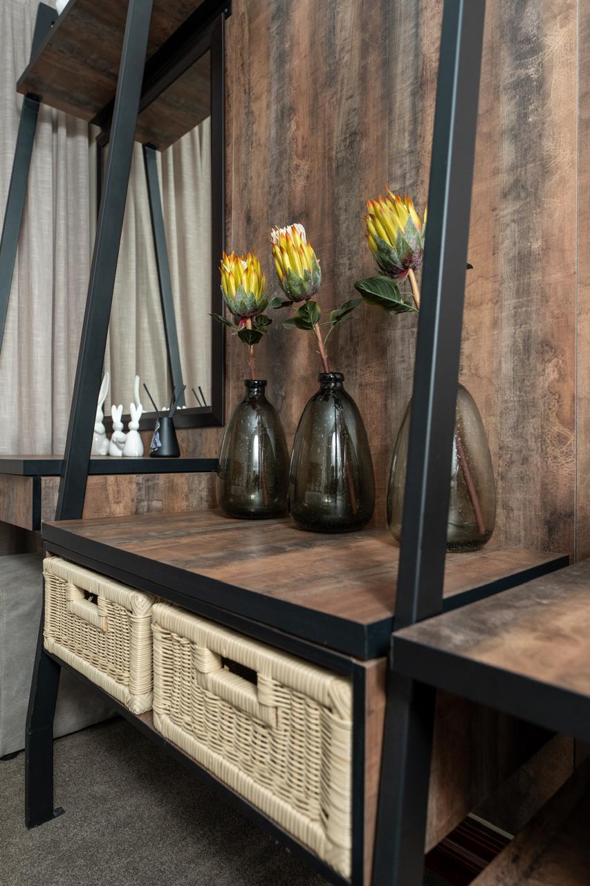 Detailed timber and black metal bedroom display unit