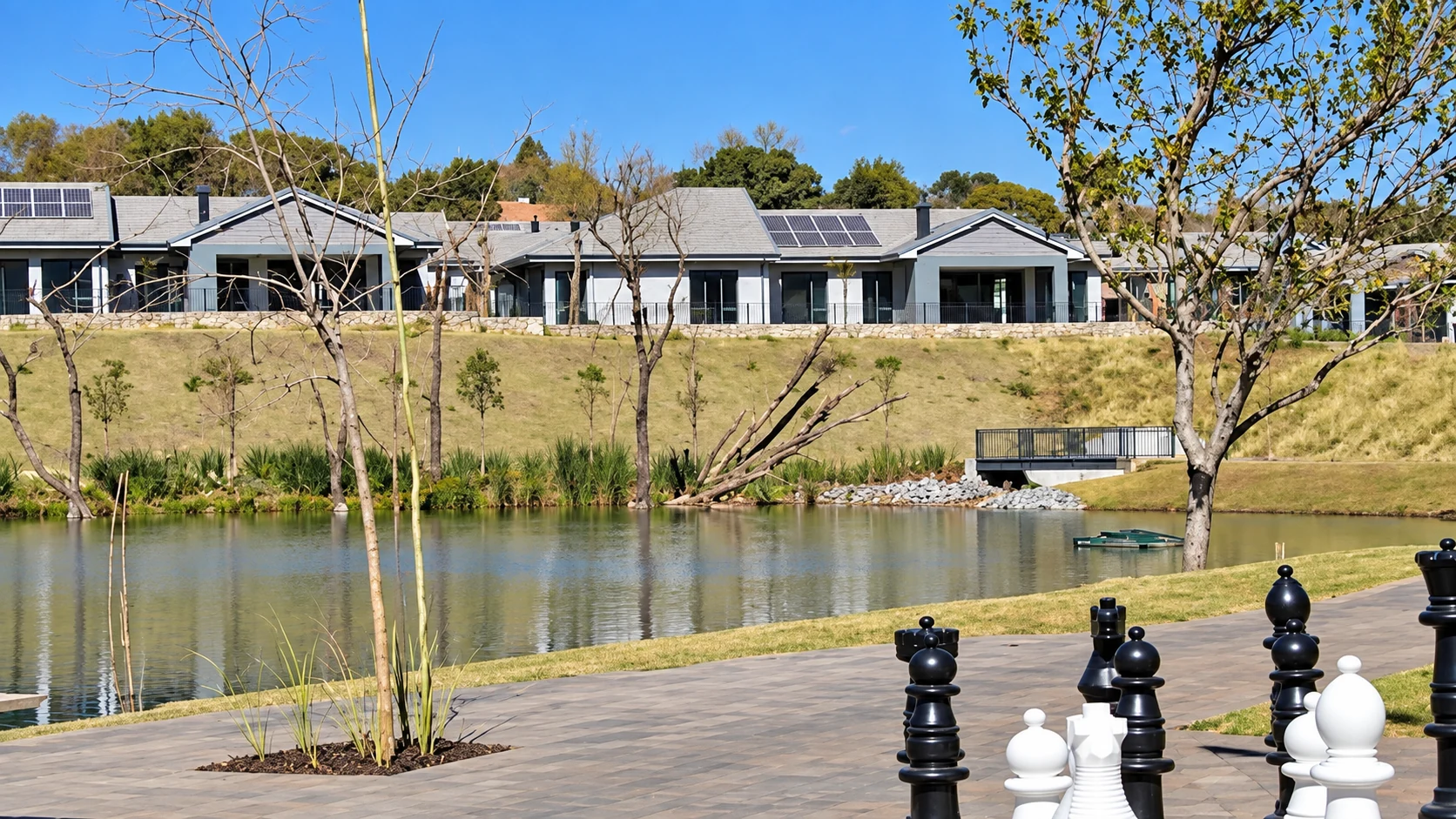 Residential estate overlooking landscaped grounds and a lake